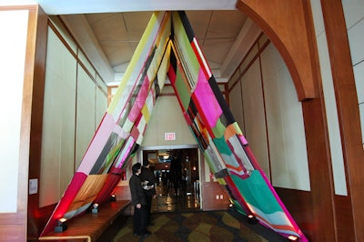 Strips of fabric formed a colorful tent at the entrance to the benefit. Created by artist Rachel Hayes, the quilt-like piece was titled 'Return to Shine.'
