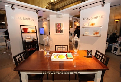 The setup included branded walls that framed areas for different activities.