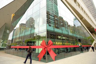 The new WNET.org Studios at Lincoln Center had an old-fashioned ribbon cutting. A new-fangled ribbon decal will wrap the building during the launch events.