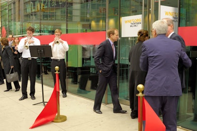 Trumpeters from Julliard were on hand to welcome their new downstairs neighbor.