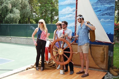 A nautical-theme photo station at the Anthem party encouraged guests to pile in for photos.