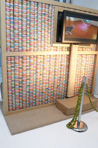 Playing off the promotion, the media wall was created using hundreds of cat food cans.