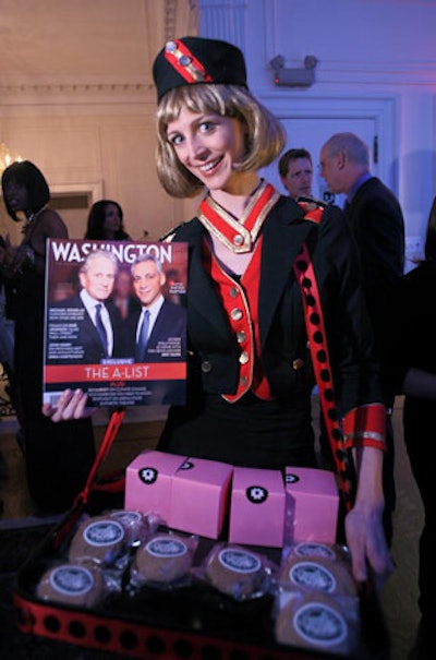 Dressed in a vintage cigarette girl uniform, Jessica Hansen passed out individual wrapped cupcakes by Georgetown Cupcakes.