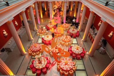 Mobiles in mod shapes hung above the tables in the atrium, while columns were lit in pink and yellow.