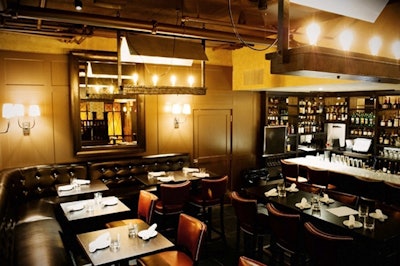 Industrial light fixtures decorate the lower-level supper club dining room.