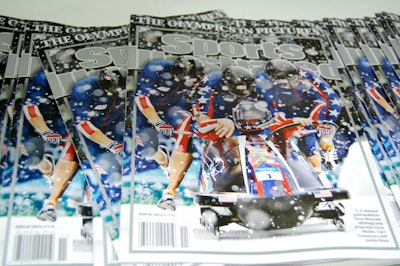 Special issues of Sports Illustrated, showing photos from the Olympics shot with Panasonic cameras, lined the wall shelves.