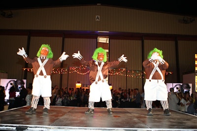 A troupe of little people performed in costume during the DJ switches.