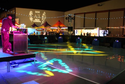 A dance floor surrounded by booth seating marked the center of the outdoor carnival space.