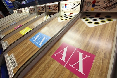 Armani Exchange logos branded a carnival-style game in which guests rolled balls to win prizes like sunglasses.