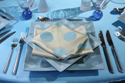 Gallery 1 tables included Fancy Dot napkins folded into 'diamond in the square' shapes atop Dot Square Ocean dinner and appetizer plates.