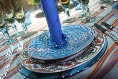 Gallery 5's whimsical palette included the turquoise Leaf Round cocktail plate atop the antique-looking Sevres plate in lilac and a turquoise glass charger.