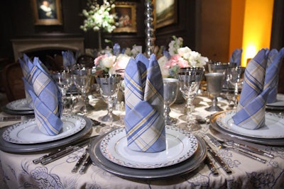 Glenboro Plaid Periwinkle napkins in 'castle' folds added a preppy note to the Little Mantle Room.