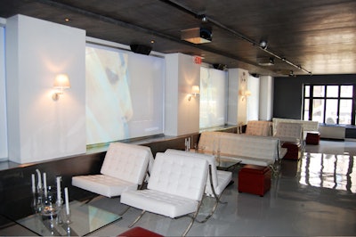 Five 5- by 7-foot projection screens fill the north wall of the space.