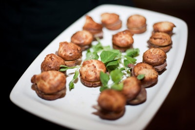 Hors d'oeuvres included braised roast beef on a mini Yorkshire pudding.