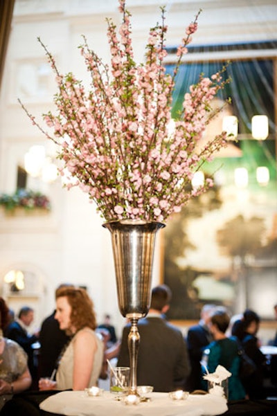 Pink florals filled a tall silver vase positioned in the centre of the event space.