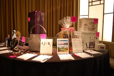 V.I.P. guests bid on items from brands like Rimowa and Rowenta at a silent auction in the Carlu's Round Room.