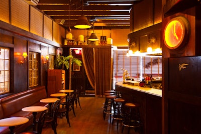 Dark woods and furnishings decorate the space.