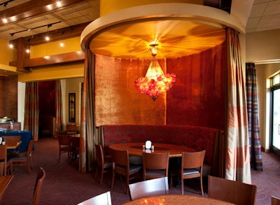 Curtains around tables in the back room can create private dining areas for groups and small parties.