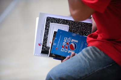 Pepsi handed out branded materials for students to take notes on organizing their own grant proposals.