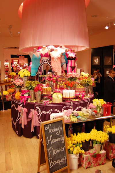 Dressed with buckets of artificial flowers, cases of new product, watering cans, and other embellishments in the brand's trademark pink, the Victoria's Secret SoHo store became a makeshift flower shop for the promotion.
