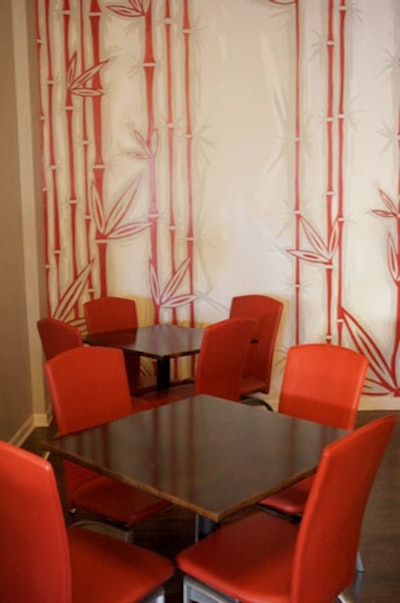 Local artist Wynn Fermin painted red bamboo on the walls at Cuna.