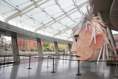 Before they broke it open for dessert, guests arrived to see the 20-foot-tall Andy Warhol piñata in perfect condition.