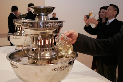 Guests not interested in pouring drinks from the spigots lining the walls could dip glasses in champagne fountains inspired by artist Marcel Duchamp.