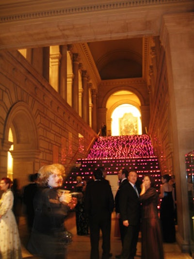 'Dangerous Liaisons' was the theme in 2004, inspired by the Met's 18th-century fashion and furniture exhibit. Isabell worked with a purple palette as a nod to sponsor Asprey's signature color. The hue was used in the arrivals carpet, exterior lighting, table linens, a 20-foot-tall lilac arrangement and 1,000 votive candles lining the stairs in the Great Hall.