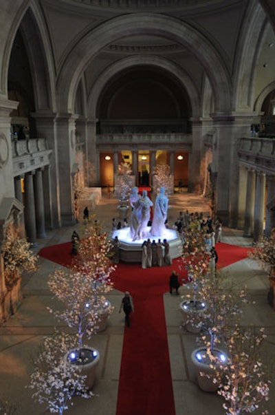 A red carpet flanked by white dogwood trees marked the path from the entrance to the exhibition.