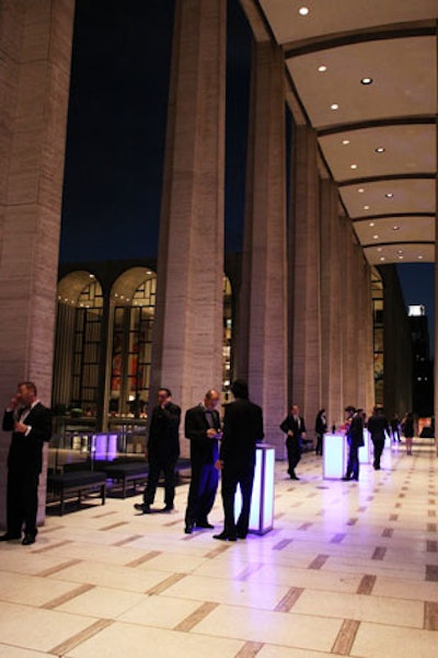 Guests ate and drank out on the terrace, which had glowing tables from Party Rental.