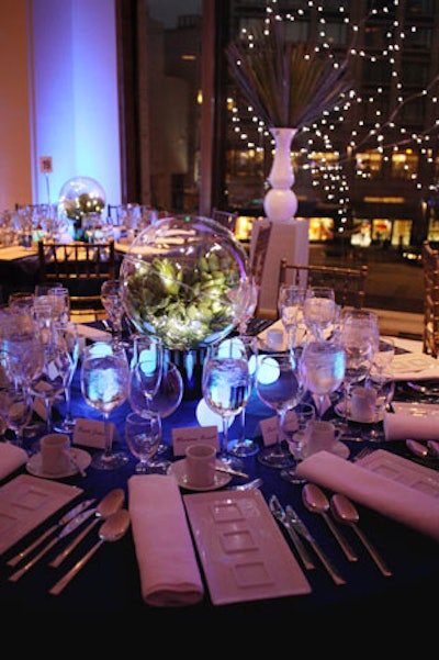 Yarce created a celestial setting with centerpieces of clear globes that contained real and faux fruits and vegetables surrounded by glowing orbs in blue and purple that replaced candles.