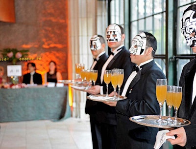 Servers wore painted masks, no two alike, and seemed to enjoy the anonymity they provided.