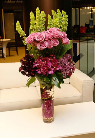 Roses and orchids in shades of purple decorated the event.