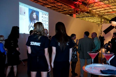 While servers circulated with specialty martinis, guests checked out the new technology that staffers use in the photo studio.