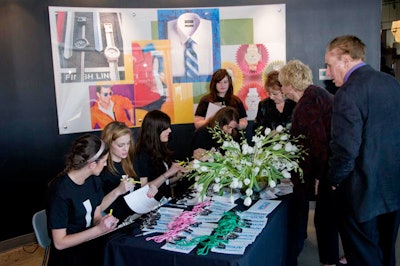 Depending on whether they worked for food or fashion companies, guests got pink or green name badges. On the back of the name badges, a map of the space pointed to areas of the warehouse that showcased either food or fashion photography.