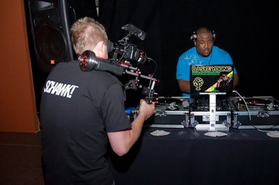 DJ Sye Young spun while staffers captured him on video.