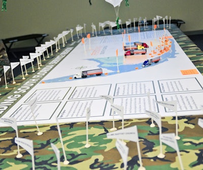 A map of South Florida had pin flags for each of the local agencies and organizations to which Feeding South Florida provides food. Plastic paratroopers suspended above the map each represented a different food bank donor.