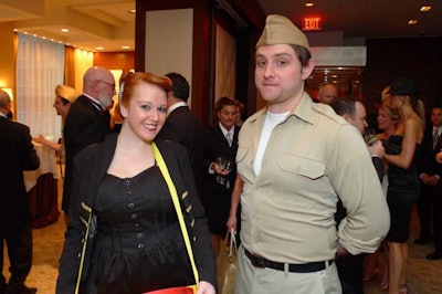 Volunteers from local theater and arts organizations dressed as 1940s cigarette girls and army G.I.s sold raffle tickets and encouraged bidding in live and silent auctions.