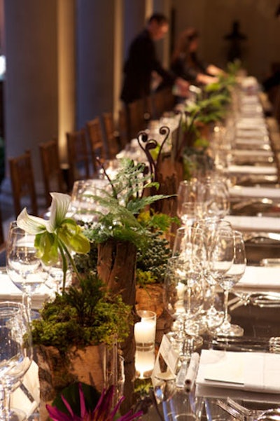 Ron Wendt Design built custom tables for the occasion, filling the museum's garden court with long, rectangular pieces topped with burlwood-framed mirrors.