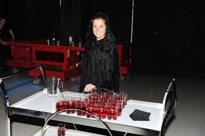 Servers dressed in hooded cloaks offered vodka cocktails—which included Mistystix dry ice stir sticks—to guests as they arrived at the after-party.