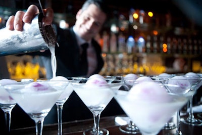 Daniel's head bartender, Xavier Herit, served white cosmopolitans at the opening-night cocktail party. The tipple was made with St. Germain, vodka, and white cranberry juice and garnished with an edible orchid submerged in a floating ball of ice.