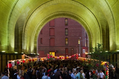 Under the Manhattan Bridge in Dumbo, the Friday-night market included a Malaysian pavilion in an adjacent lot on Water Street and beer, cocktails, and other beverages served in a nearby loft.