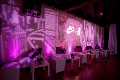 Logos for Nike and St. Alfred lit up the walls of the basement lounge area, which required a three-day setup and an outside power source.