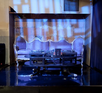 The setup for DJ duo Flosstradamus included an ornate vintage sofa.