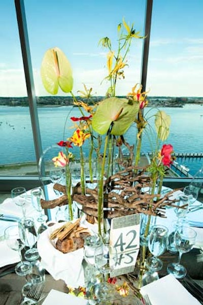 Bright flowers and driftwood added an organic vibe to the contemporary dinner decor.