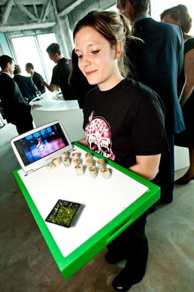 Mini screens placed on serving trays displayed work from the museum's teen programs.