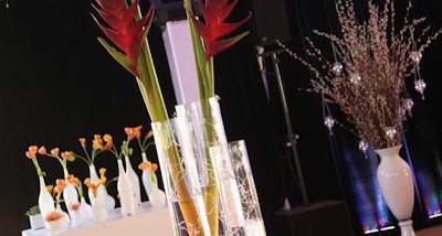 A variety of glass vases and flowers anchored the tables and seating areas in the reception tent.