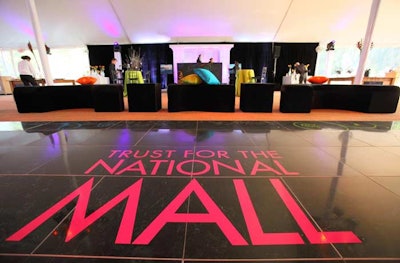 A variety of cushioned seating arrangements flanked the dance floor in the main reception tent.