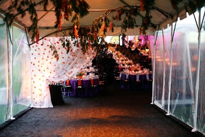 Hanging branches and flower-flecked curtains spruced up the entrance to the tent.