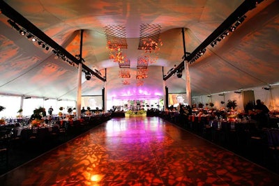 Butterfly-shaped lights shone on the dance floor, where Bukiety hung a mobile made from recycled twigs and paper butterflies with embedded seeds.